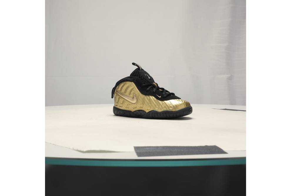 nike little posite one black and gold